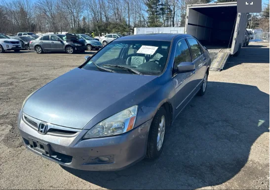 Gray Honda Accord at an auto auction lot awaiting dealer transport pickup
